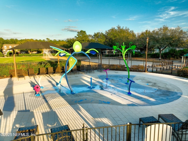 view of pool with a playground