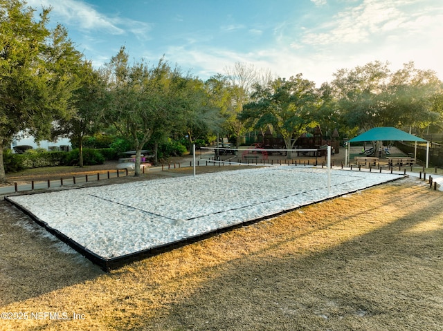 view of home's community featuring volleyball court