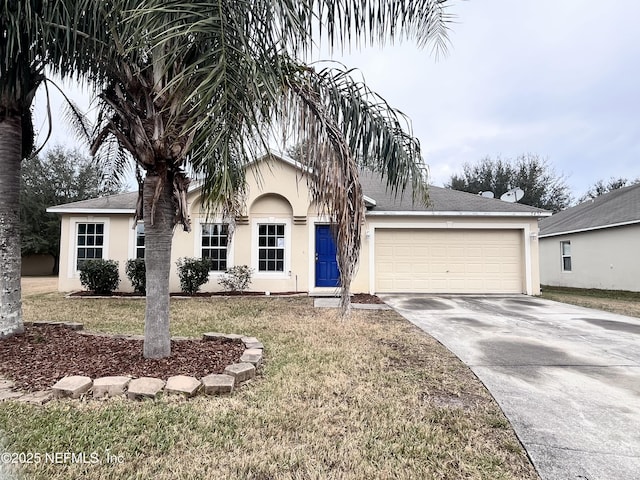 view of front of property featuring a front lawn and a garage