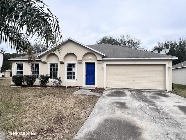 ranch-style home with a garage and a front yard