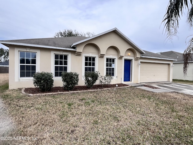 ranch-style home with a front yard and a garage