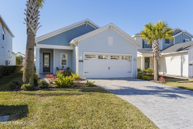 view of front of home featuring covered porch, a front lawn, and a garage