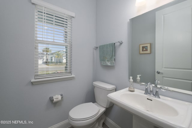 bathroom featuring sink and toilet