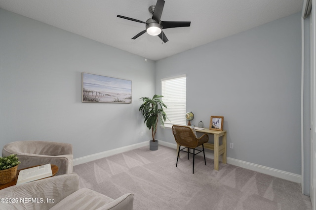 carpeted home office with ceiling fan