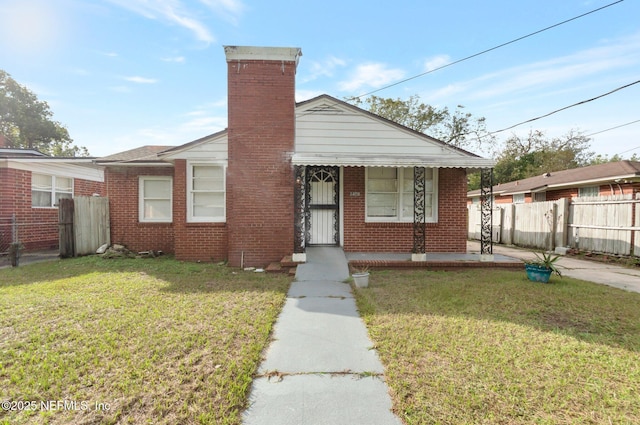 bungalow-style house featuring a front yard