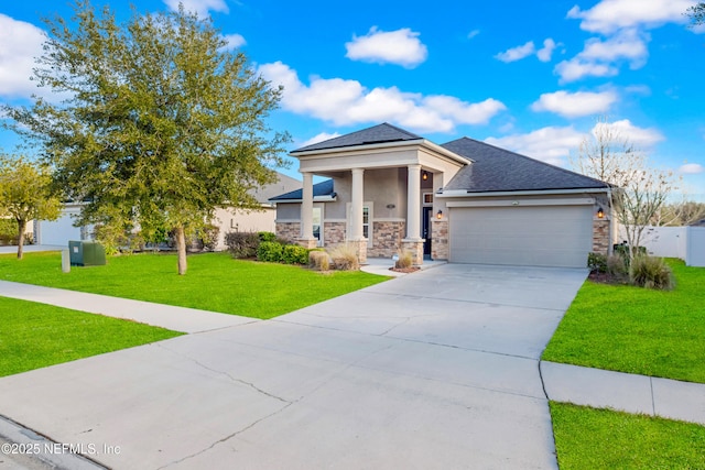 view of front of home featuring a garage and a front yard