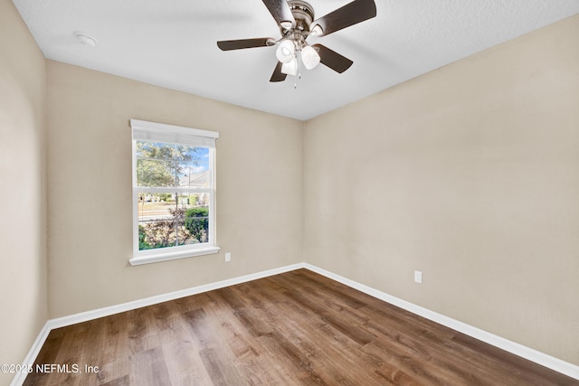 unfurnished room featuring ceiling fan and hardwood / wood-style floors