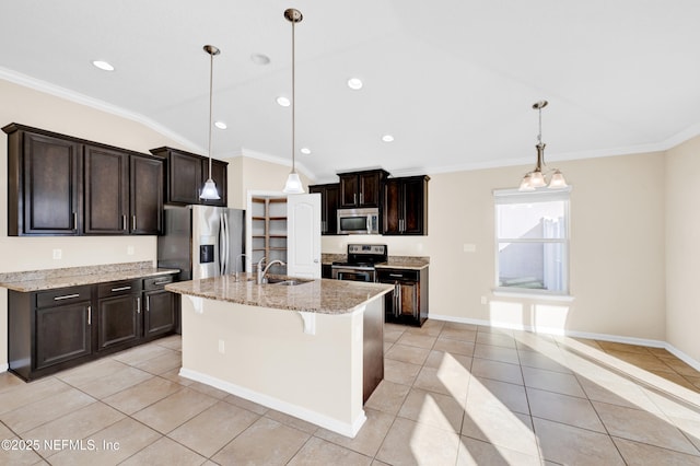 kitchen with a center island with sink, pendant lighting, crown molding, stainless steel appliances, and light tile patterned floors