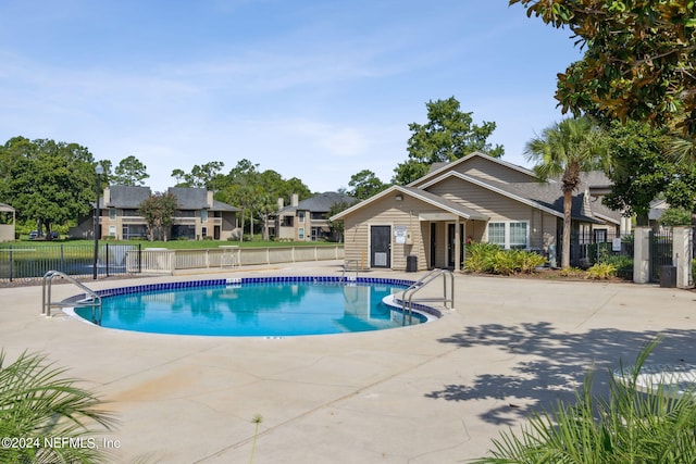 view of swimming pool featuring a patio area