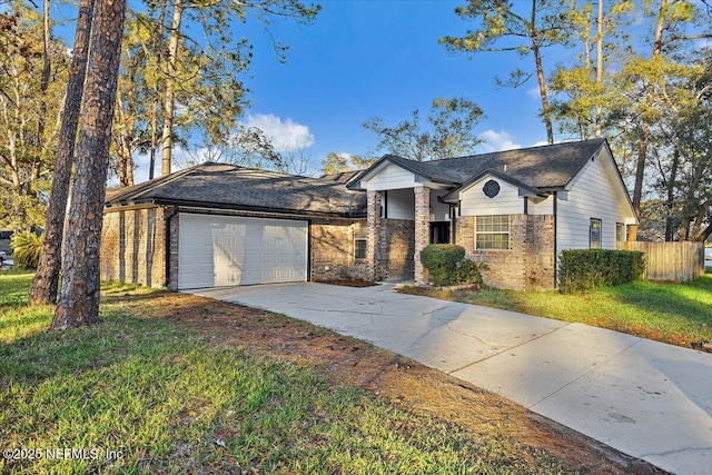 view of front of house featuring a garage and a front yard