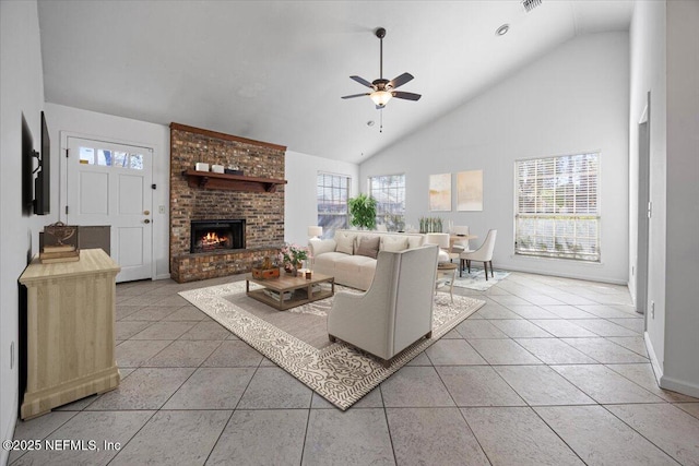 tiled living room featuring ceiling fan, high vaulted ceiling, and a fireplace