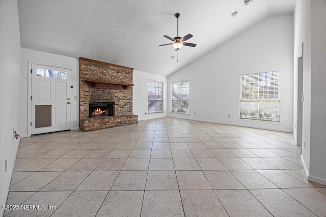 unfurnished living room featuring a fireplace, high vaulted ceiling, ceiling fan, and light tile patterned flooring