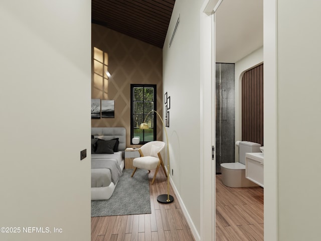 hallway with light hardwood / wood-style floors