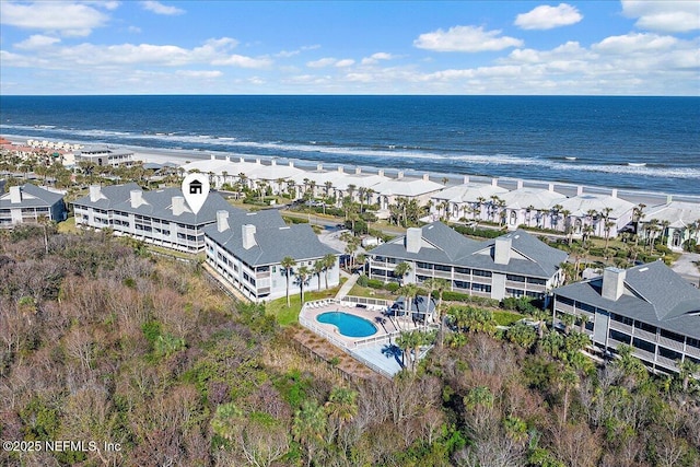 bird's eye view featuring a water view and a view of the beach