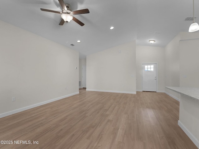 unfurnished living room with ceiling fan and light wood-type flooring