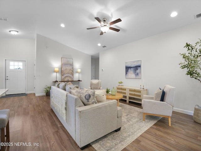 living room with ceiling fan, hardwood / wood-style floors, and lofted ceiling