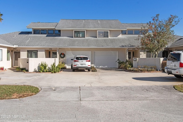 front facade with a garage