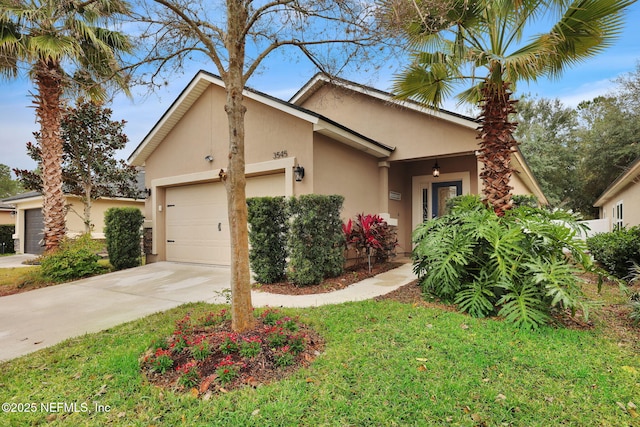 view of front of home with a garage and a front lawn