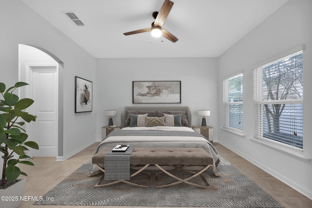 tiled bedroom with ceiling fan