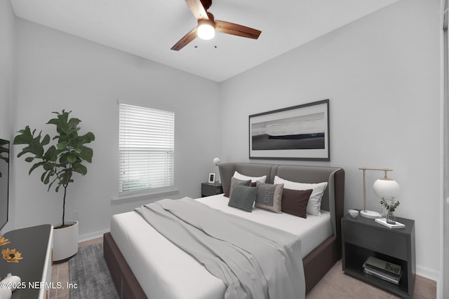 bedroom featuring hardwood / wood-style flooring and ceiling fan