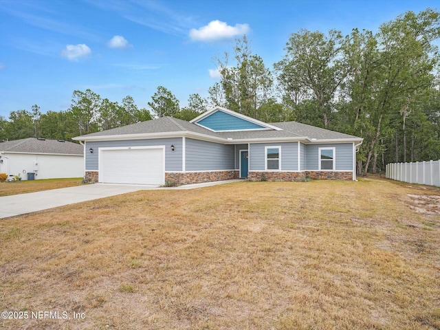 ranch-style home with a garage and a front yard