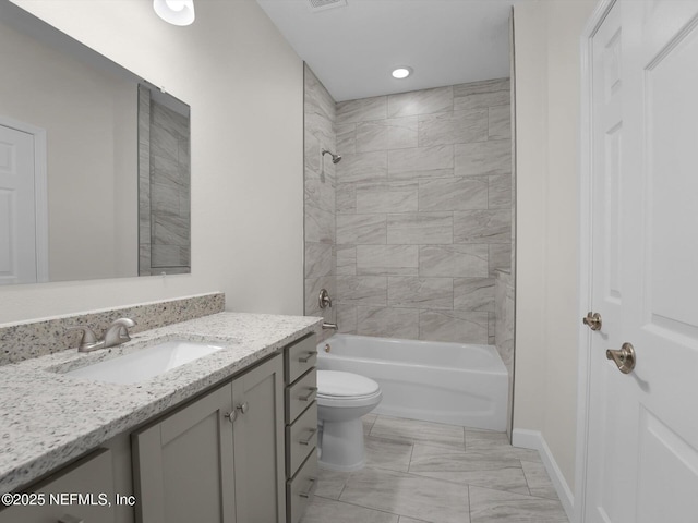 full bathroom with toilet, tiled shower / bath combo, and vanity