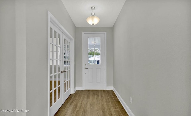 doorway to outside with french doors and hardwood / wood-style flooring