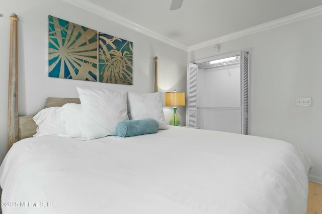 bedroom with ceiling fan, a closet, and crown molding