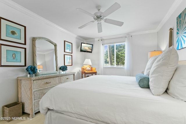 bedroom featuring ceiling fan and crown molding