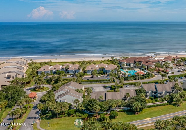 aerial view featuring a view of the beach and a water view