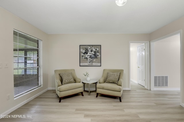 sitting room featuring light wood-type flooring