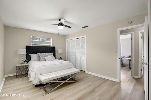 bedroom featuring a closet, ceiling fan, and light wood-type flooring