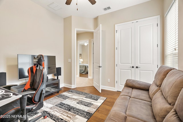 office space with ceiling fan and dark hardwood / wood-style floors