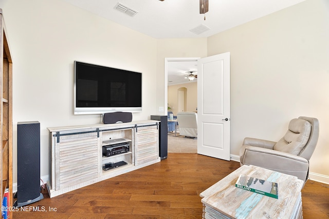 sitting room with hardwood / wood-style flooring