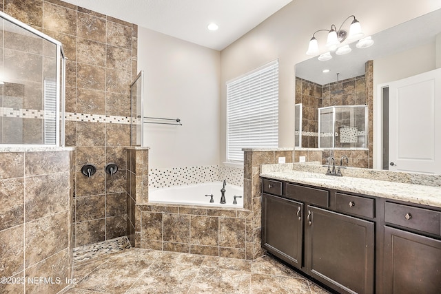 bathroom featuring shower with separate bathtub and vanity