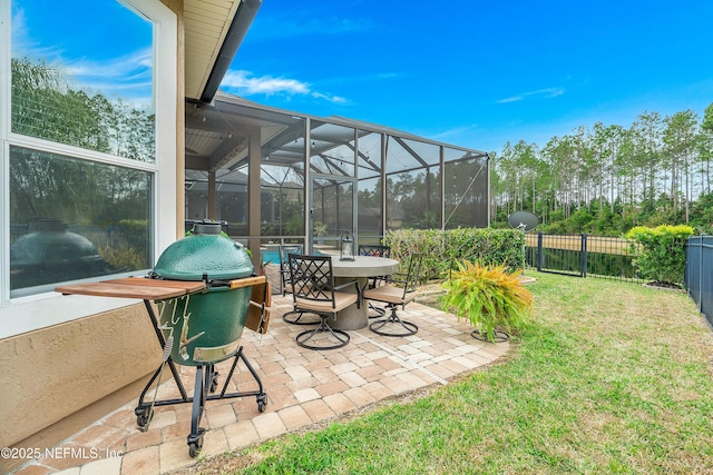 view of patio featuring glass enclosure