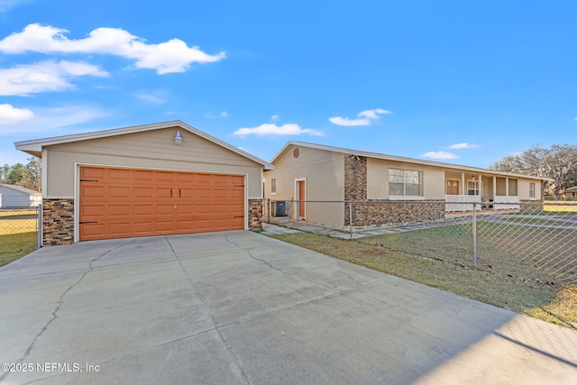 ranch-style house featuring a porch, cooling unit, and a front yard