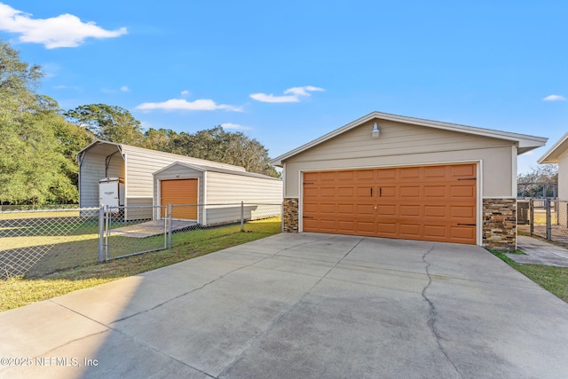 garage featuring a yard and a carport