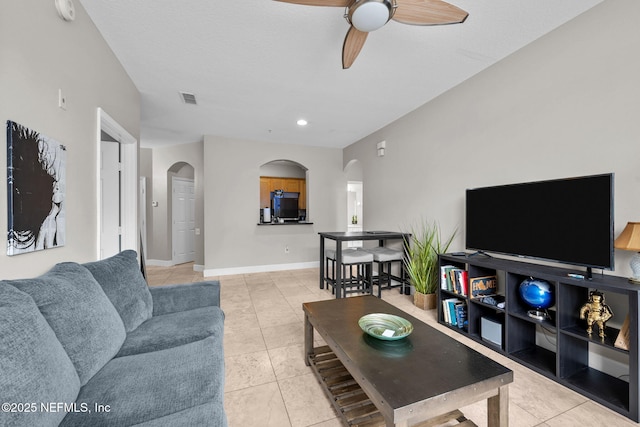 living room featuring ceiling fan and light tile patterned floors