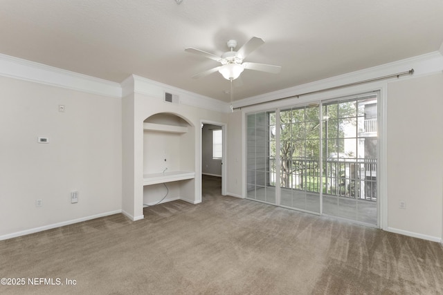 unfurnished living room with ornamental molding, ceiling fan, and carpet