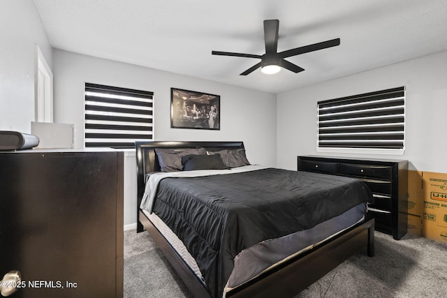 bedroom featuring light carpet and ceiling fan