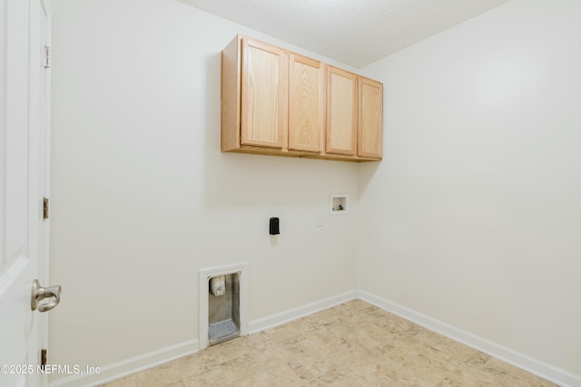 laundry area with cabinets, hookup for an electric dryer, and washer hookup