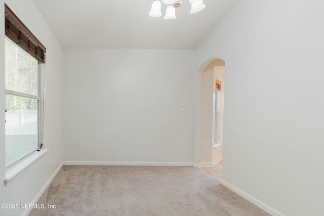 spare room with light colored carpet