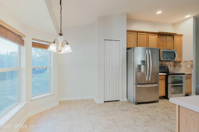 kitchen featuring decorative backsplash, an inviting chandelier, pendant lighting, and appliances with stainless steel finishes