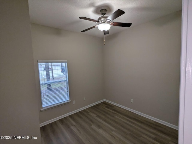 spare room with dark wood-type flooring