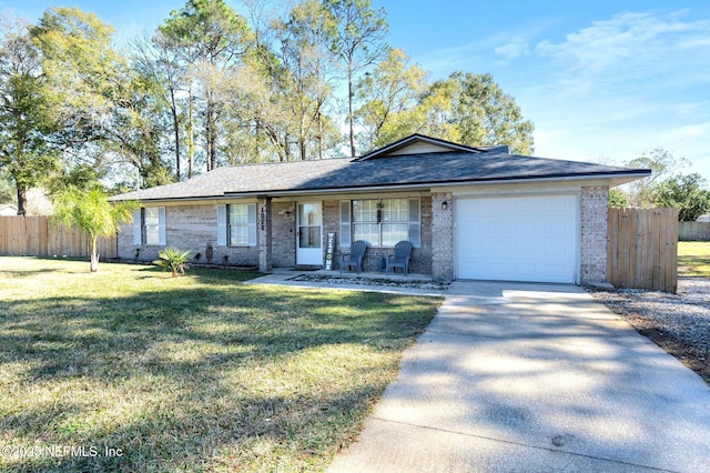 ranch-style house with a porch, a front yard, and a garage