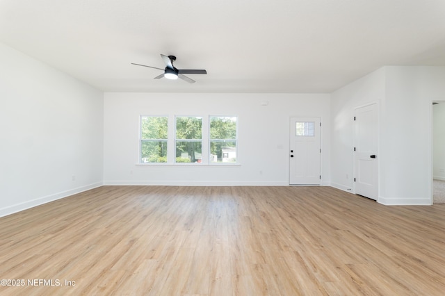 unfurnished living room featuring light wood-type flooring and ceiling fan