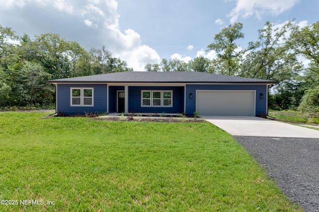 ranch-style home featuring a front lawn and a garage