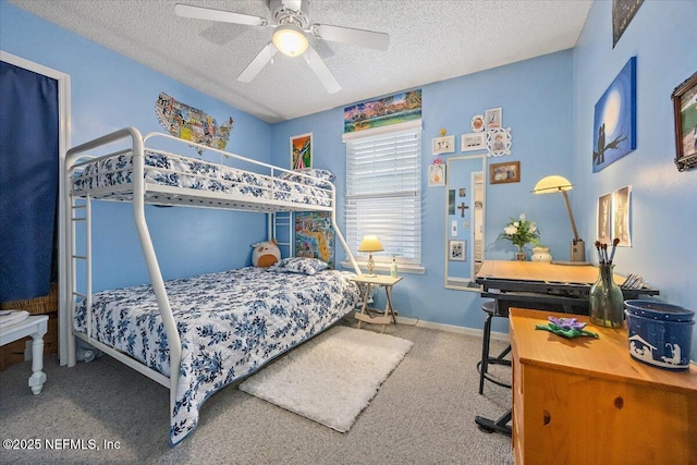 carpeted bedroom with a textured ceiling and ceiling fan