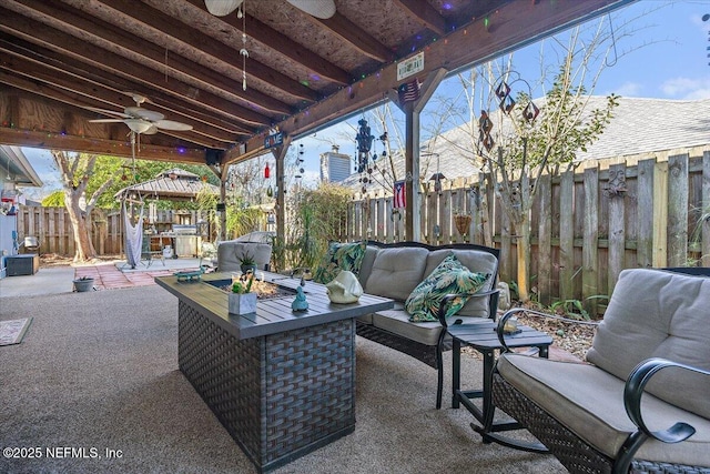 view of patio featuring a gazebo, outdoor lounge area, and ceiling fan